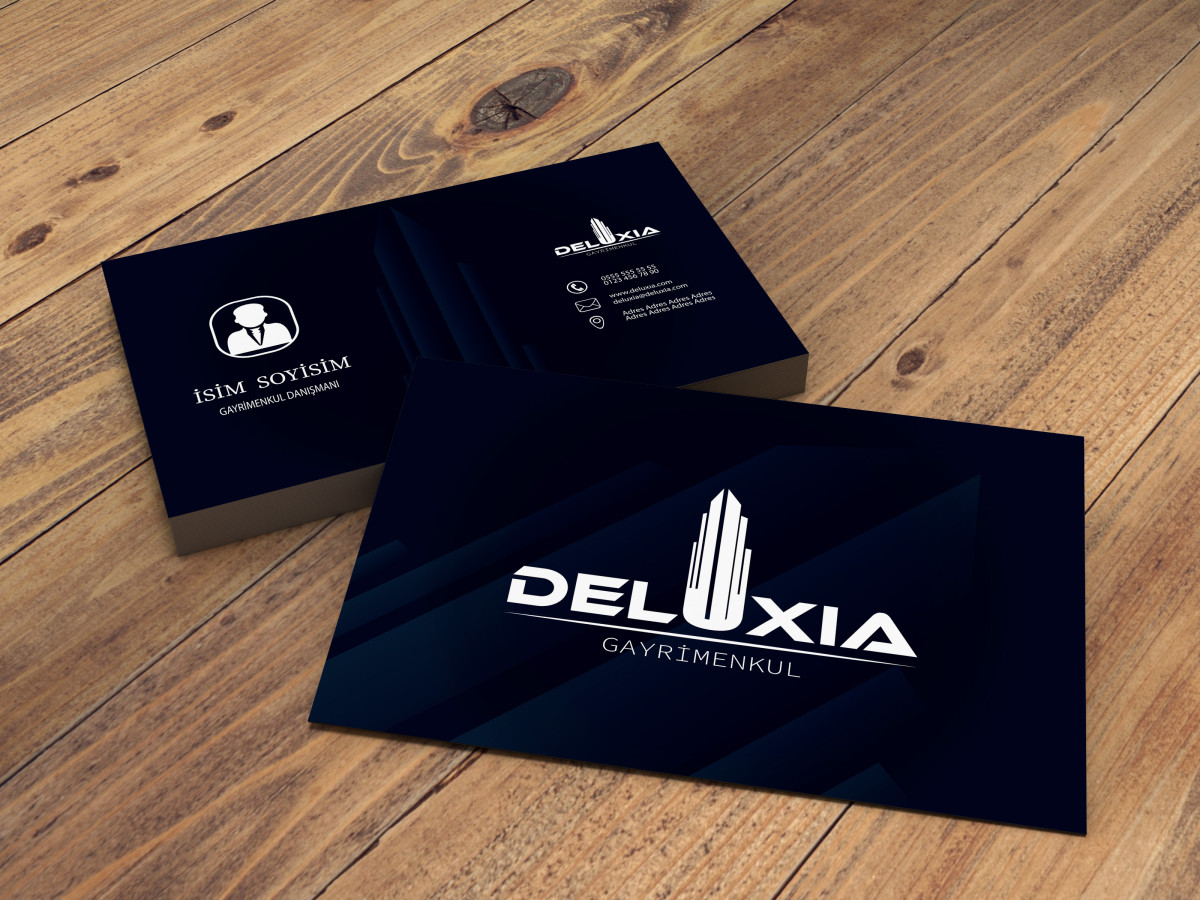 Tasarlayan DesigNero-DELUXIA GAYRİMENKUL KARTVİZİT TASARIMI