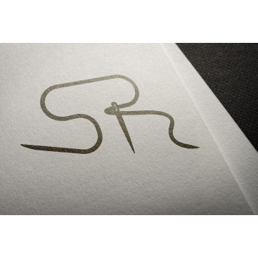 Tekstil firma logosu yarışmasına tasarımcı KAYREAN tarafından sunulan  tasarım 